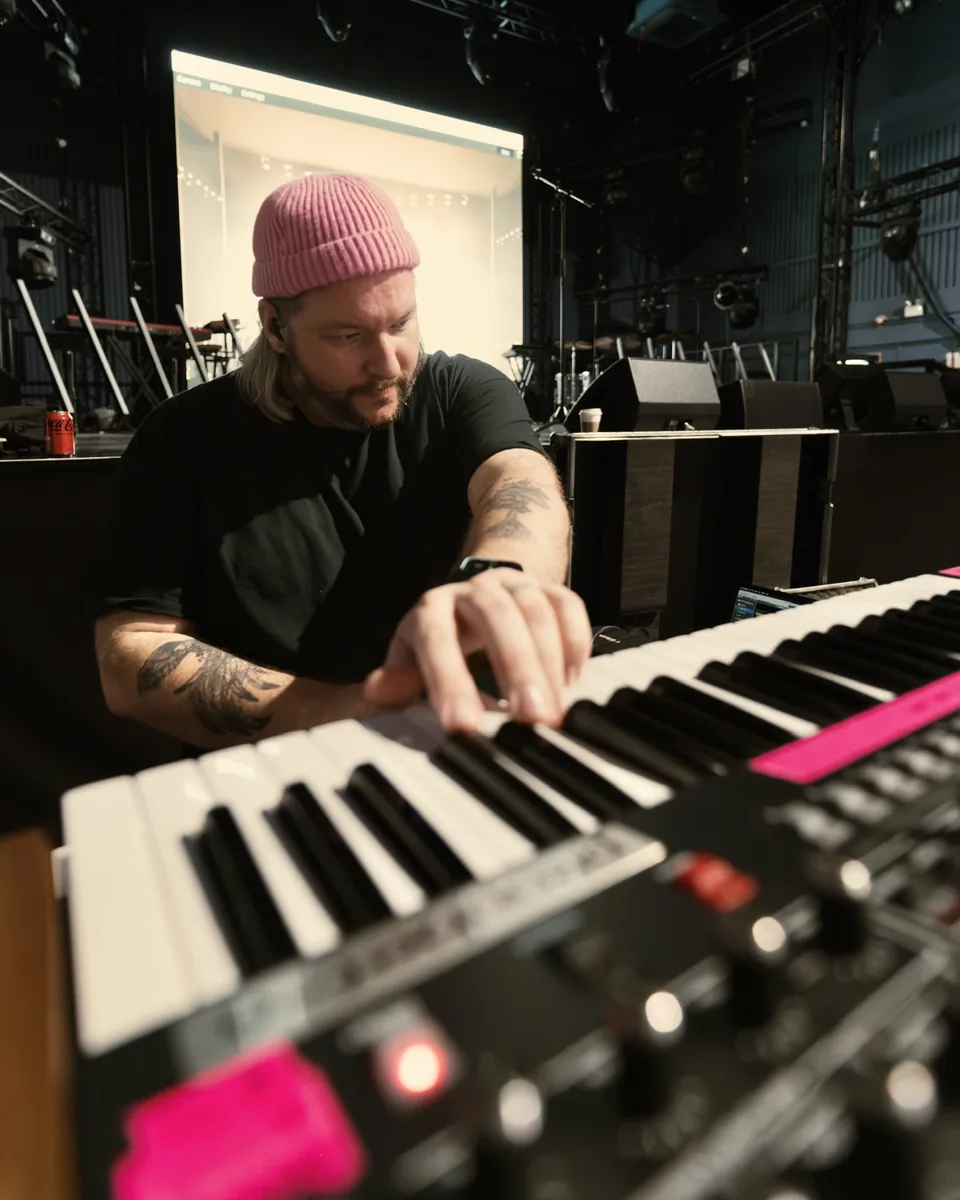 David Andrew preparing keyboards backstage