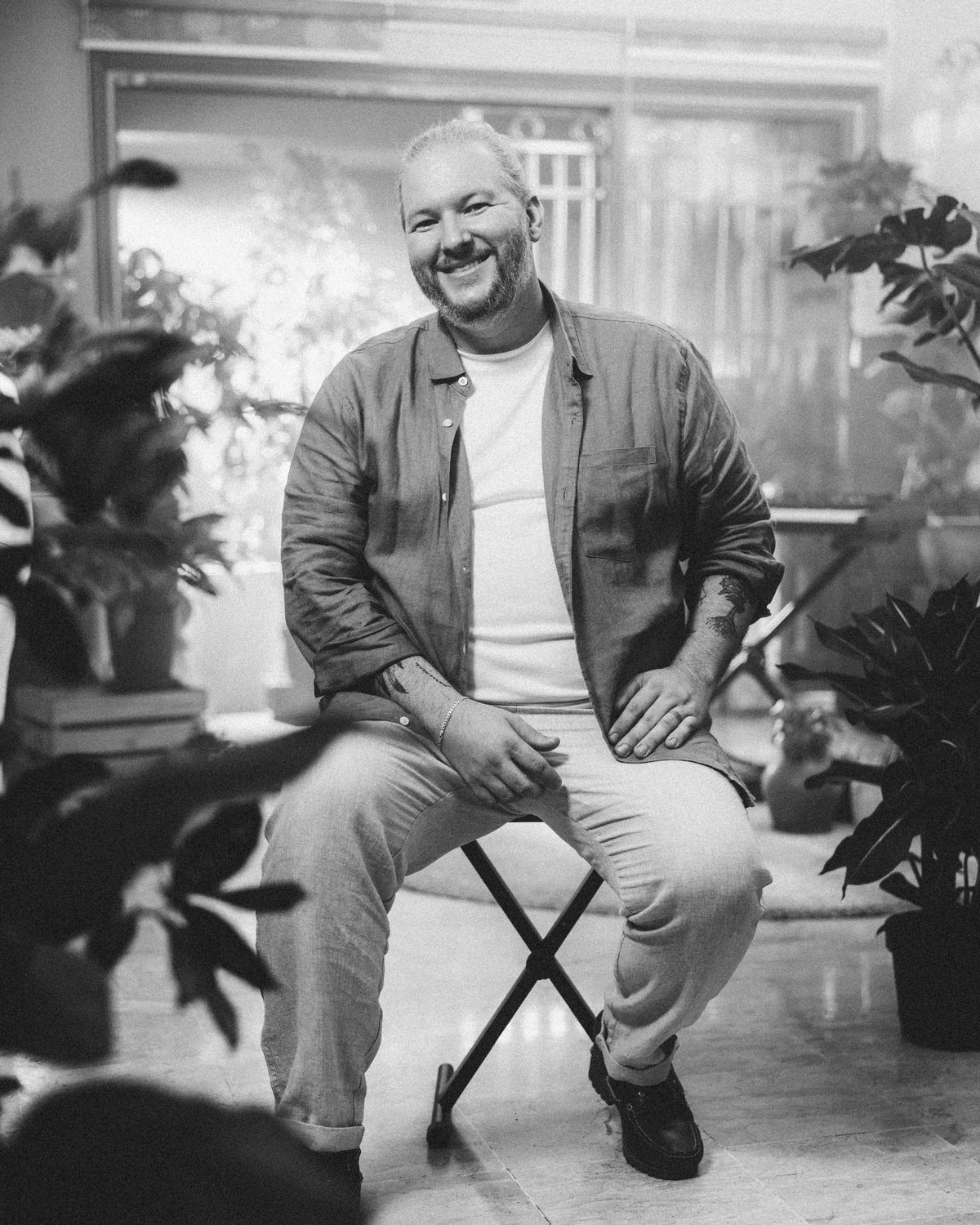 David Andrew seated in his Kuala Lumpur studio, black and white portrait
