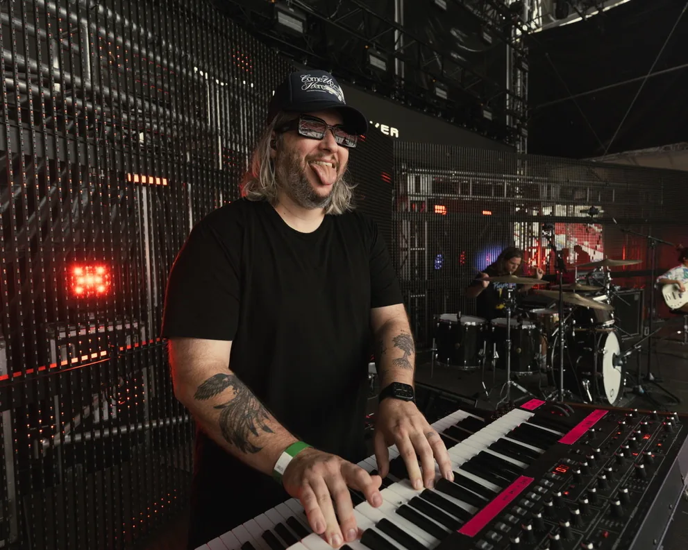 David Andrew having fun backstage at the keyboard